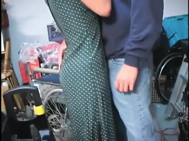 Watch fake titty MILF get on the floor and suck his penis