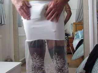 Tight white skirt showing suspender bumps