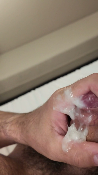Hairy man masturbates on the bed and cums on his dick | Clip 3