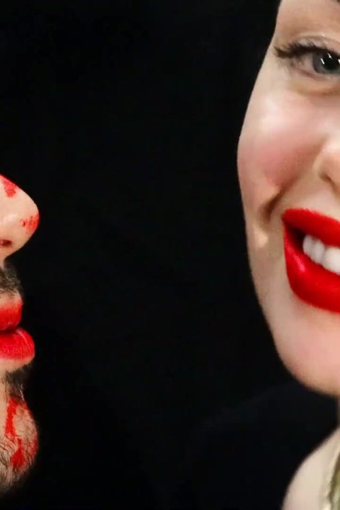 Covering Alex face with red lipsticks kisses