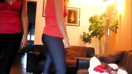 Two girl jumping on teddy bear