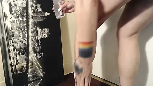 Oiled calves flexing calve muscle