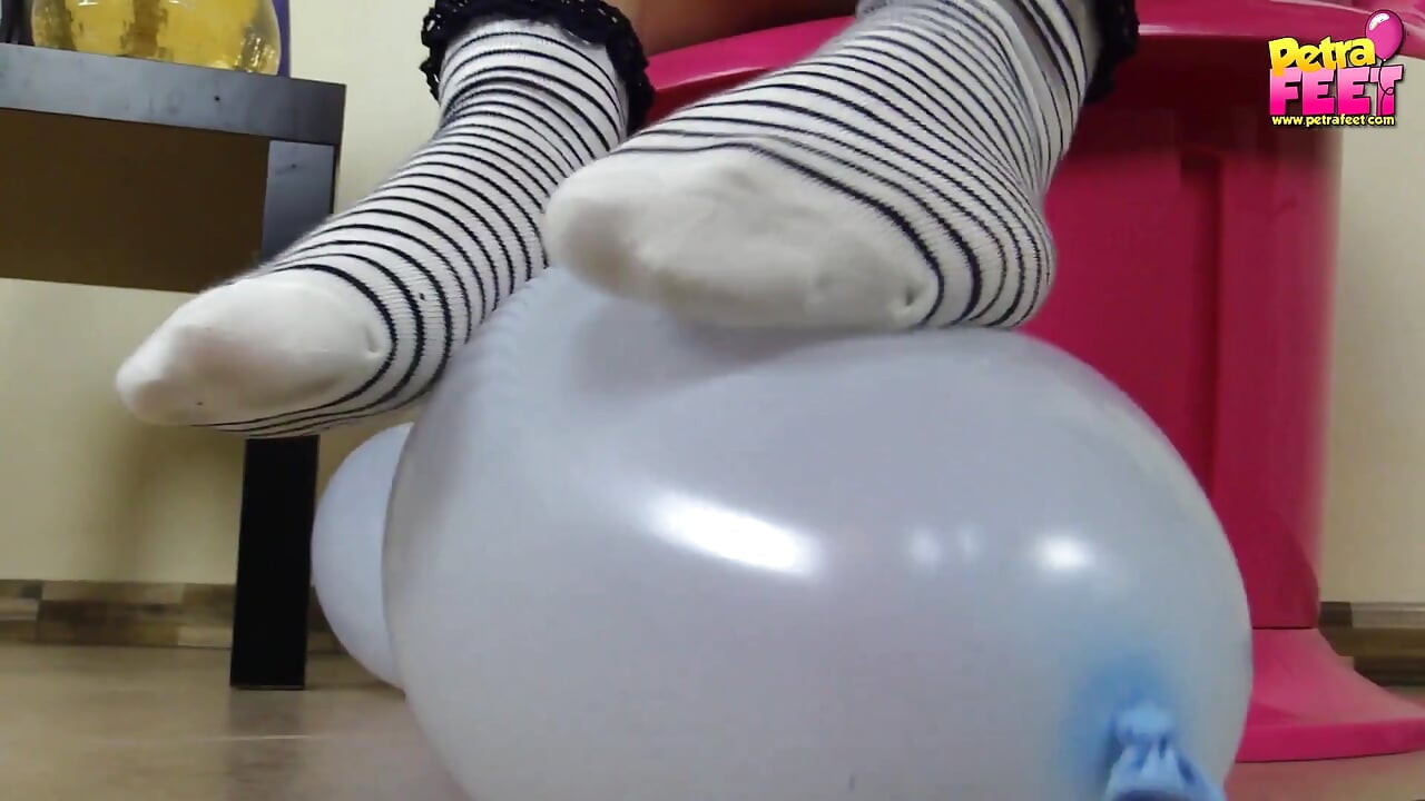 Petra plays with balloons and her feet