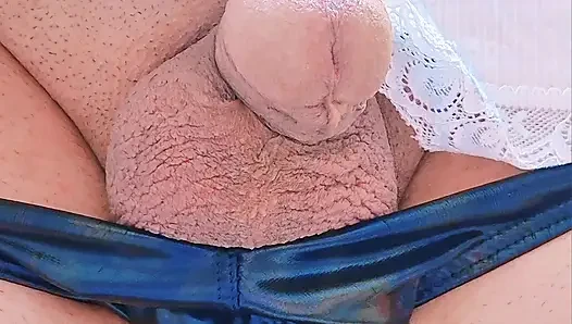 My flaccid penis is under my wife's strap