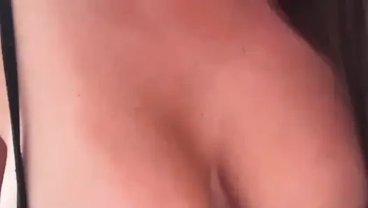 The stepmother is fucking her pussy and shaking her big tits.