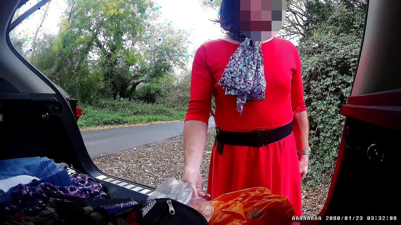 Just getting changed parked at side of road with cars driving past