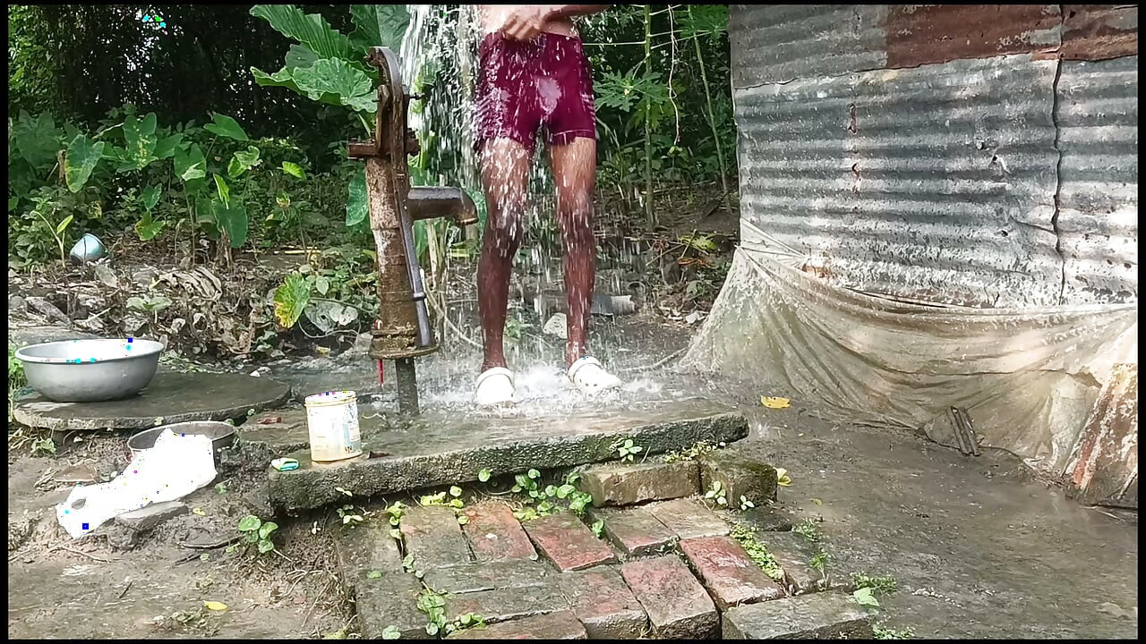 Black mature man bath in desi style. Showing big dick.