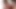 Short-haired ladyboy in pink dress strokes her small cock in