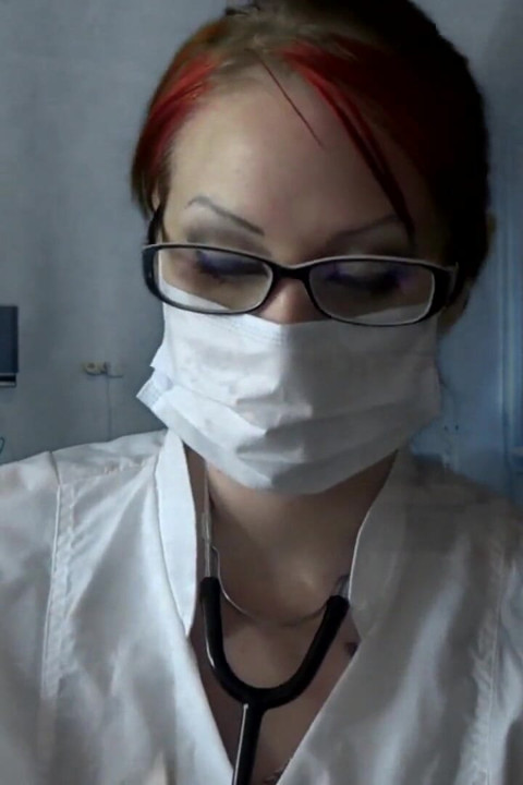 Doctor eating in medical mask and gloves