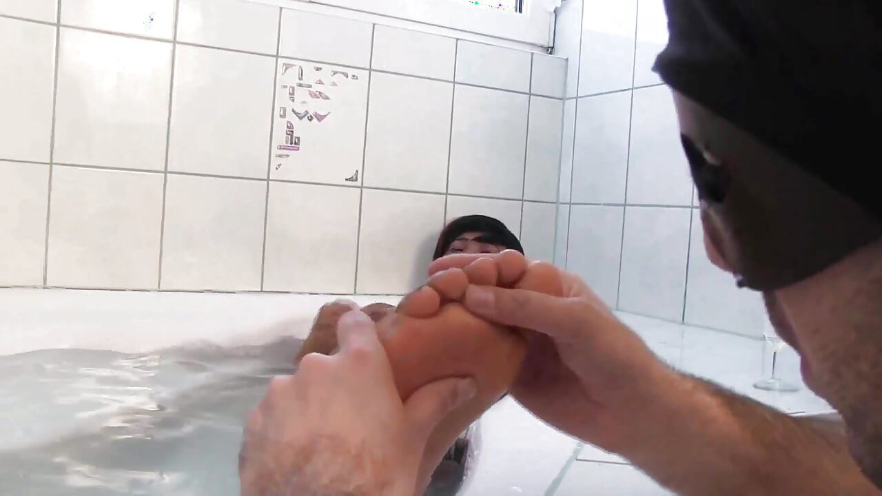 Ebony foot massage in the bathroom