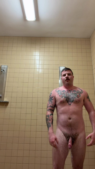 Uncut tattoo jock showering after gym