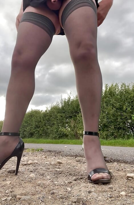 Crossdresser  husband out for a drive, walk and wanking in heel and stockings.
