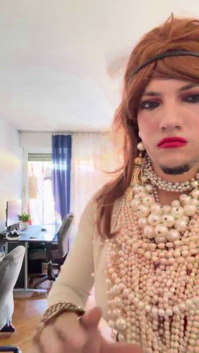 Crossdresser walking around heavily aroused  the apartment in the high heels and lovely pearls and heels.