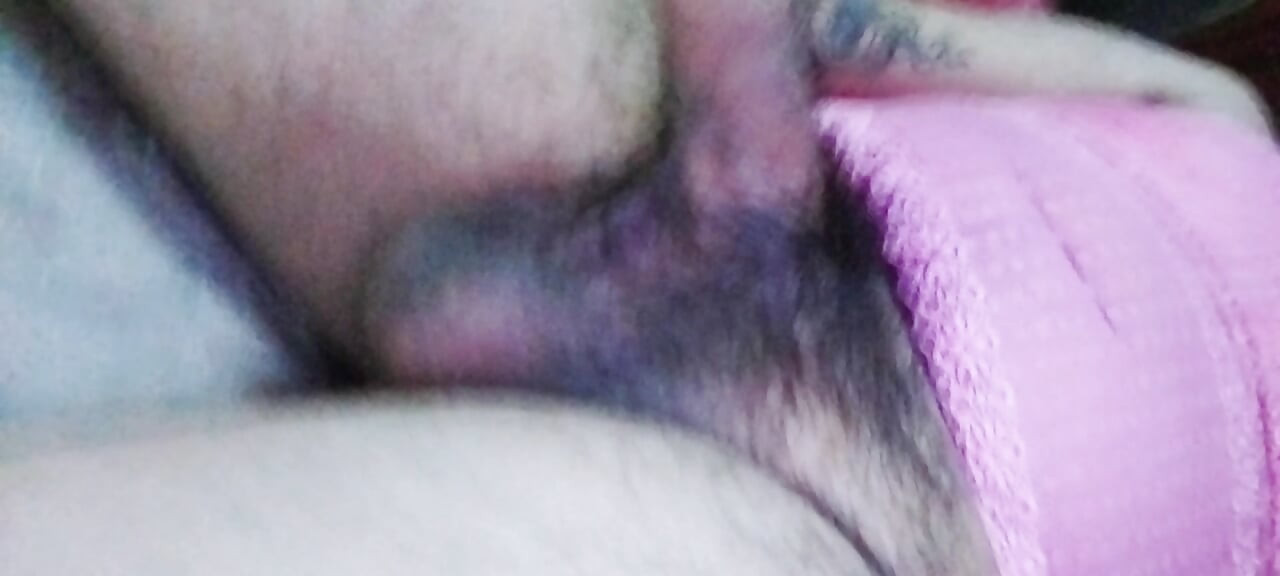 Shemale masturbates lying down