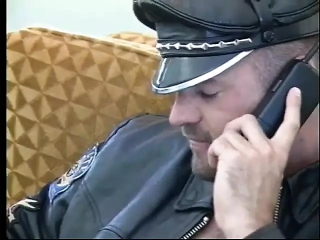 Handsome police officer has sex with a leather guy