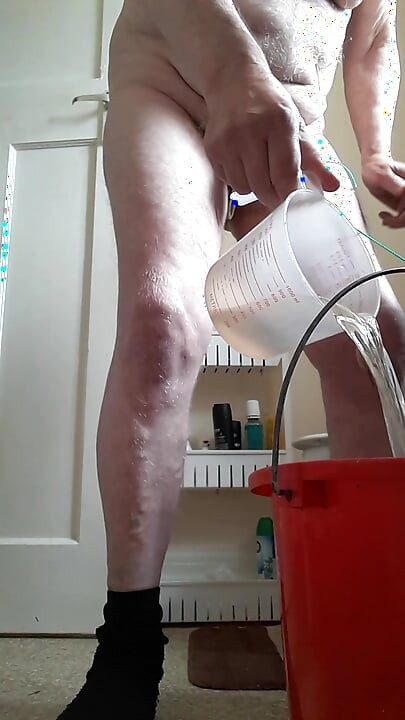 Bucket water tied onto my balls