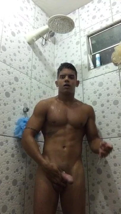 Latino showers and shows off