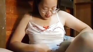Asiática linda sexy en cosplay de enfermera