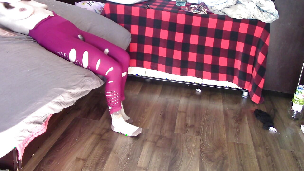 Amateur wife dancing and trying on clothes she cuts. Amateur wife vacuuming in bedroom.