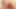 Redhead ladyboy in white dress stuffs an anal toy up her