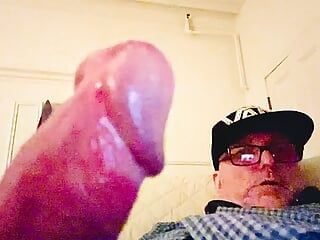 Grandpa masturbates his huge penis and cums.