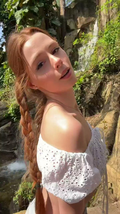 Enjoying a sunny day right by the waterfall