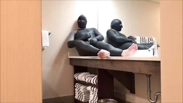 Spiderman changes into wetsuit and wank