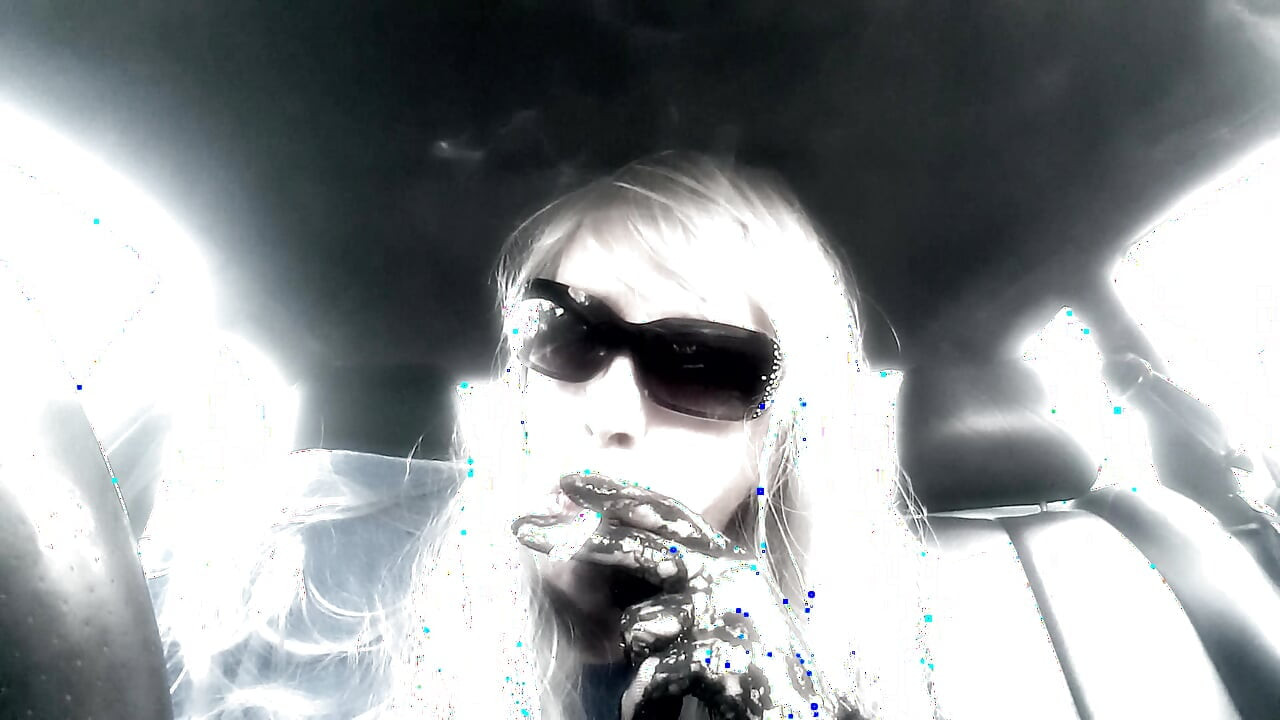Mrs. Ruthie Dommie Mommy smoking Marlboro 100s in her car