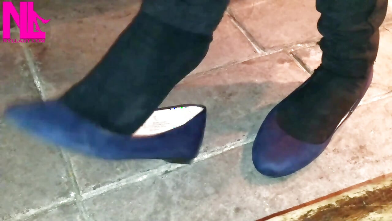 Dangling in Blue Ballet Flats in a Bar
