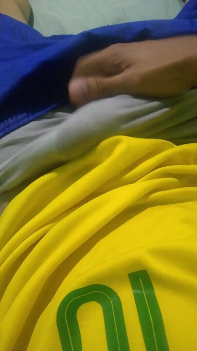 Pov young Brazilian guy masturbating big thick dick wearing the Brazilian national team uniform