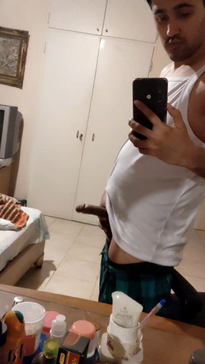 The Iranian boy shows him in front of the mirror and squeezes