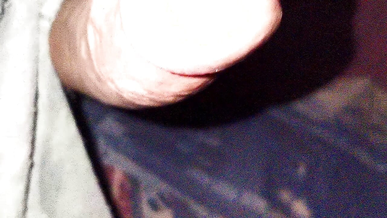 Playing with the head of a wet penis