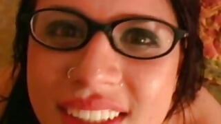 getting a hot blowjob from this latina babe wearing glasses