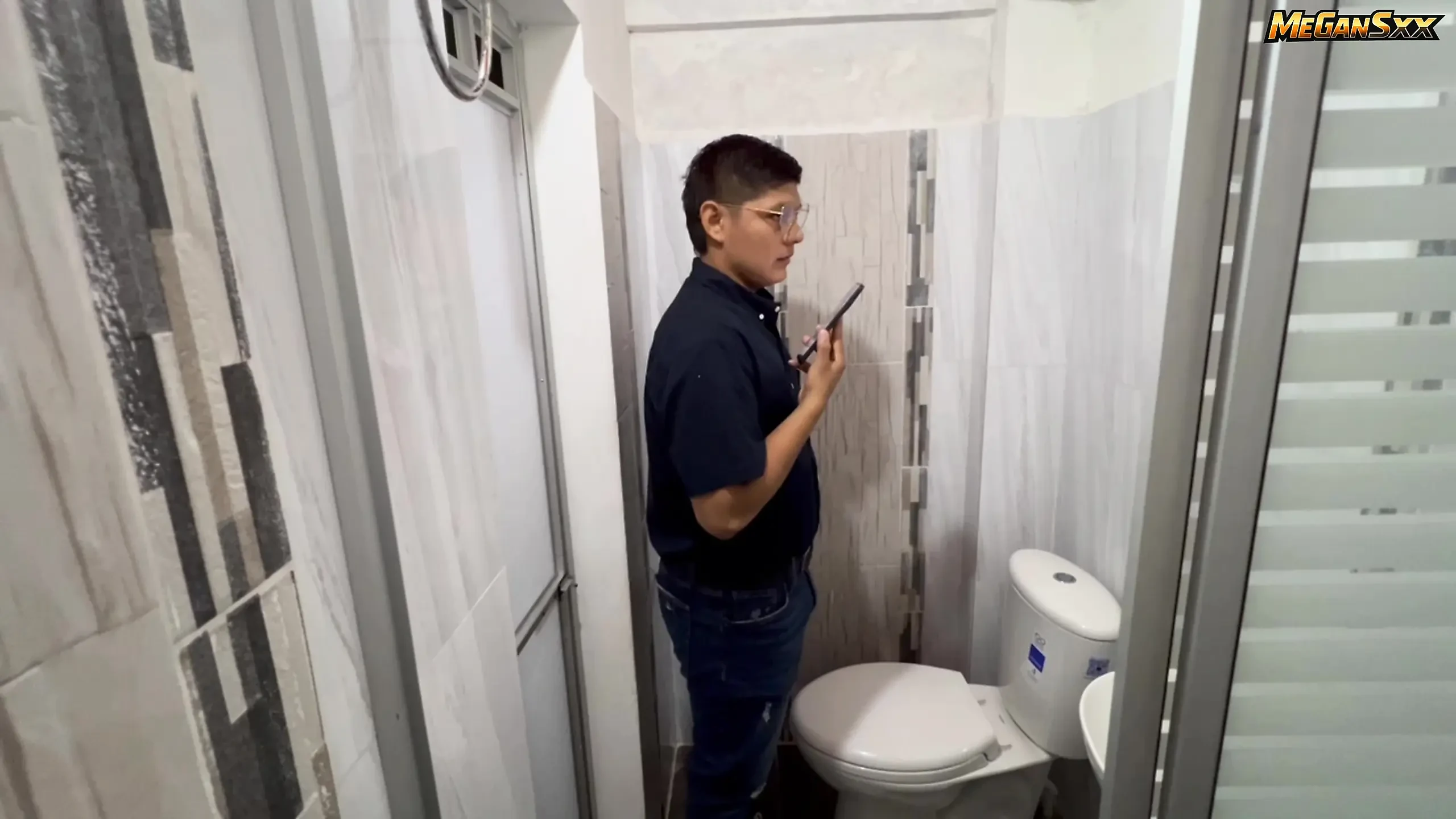 Teacher his student in the bathroom.