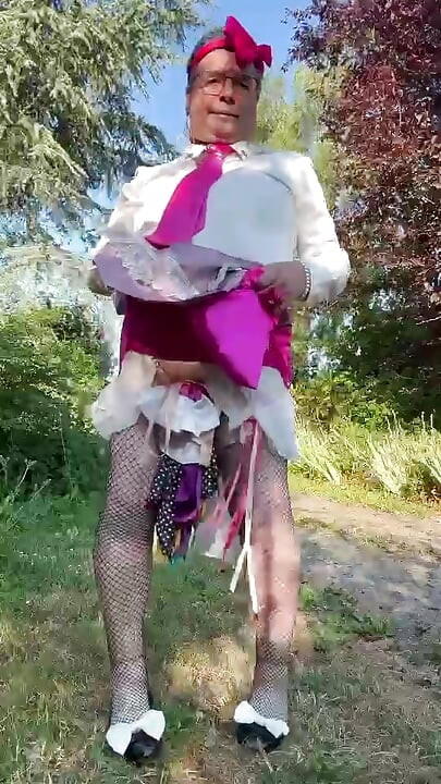 In little maid outfit with a short fuchsia skirt for a day