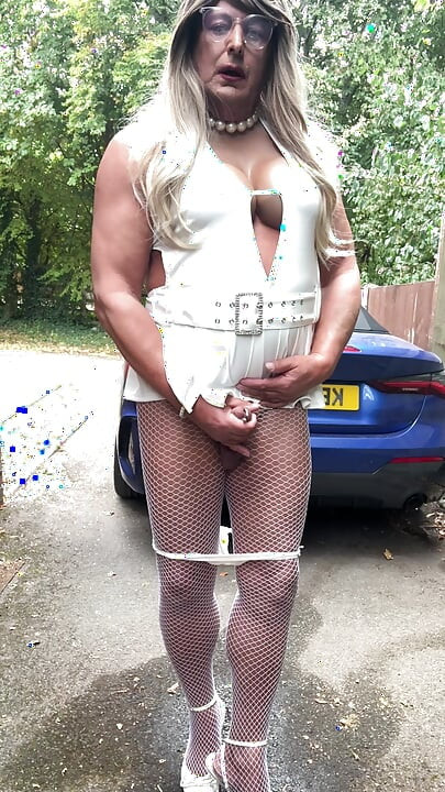 Sexy Crossdresser kellycd2022 in sexy white mini dress and fishnet pantyhose and heels