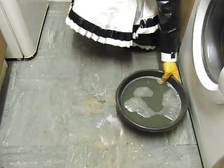 Maid Scrubs a Filthy Kitchen Floor