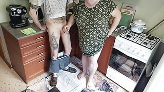 a fat woman jerks off my dick in the kitchen and I cum powerfully