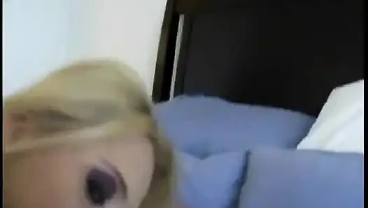 Blonde with great tits lies on the bed to get laid