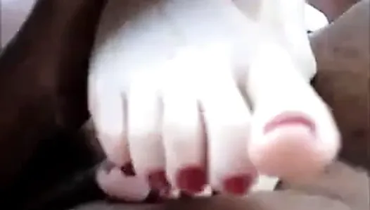 under the table footjob