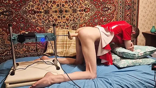 Sasha Earth in an erotic costume having sex with a fuck machine homemade