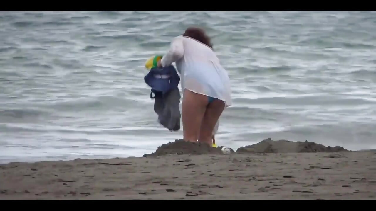 My Wife, a Beautiful 58-year-old on the Beach, Shows off and Masturbates with Hers