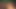 ピンク髪の美女が大きな人と楽しんでいる