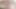 彼女は笑いながら、彼の哀れな小さなペニスを手で動かす