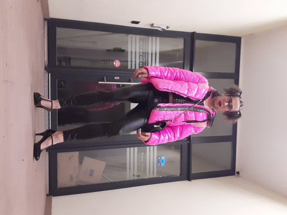 Sissyslut in front of the hotel entrance