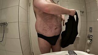 Chubby guy touches his body