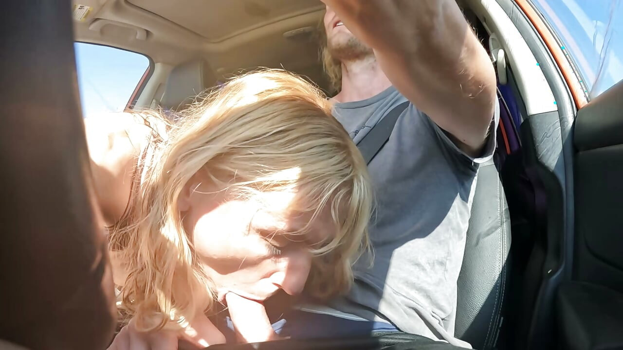 Petite Blonde Gives Her Man Road Head In The Car