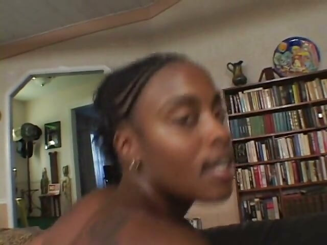 Horny ebony sits on a big white dick and fucks it hard with her pussy