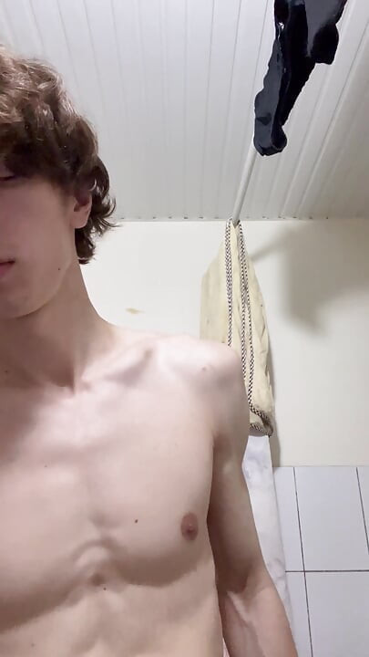 Sexy boy taking a shower