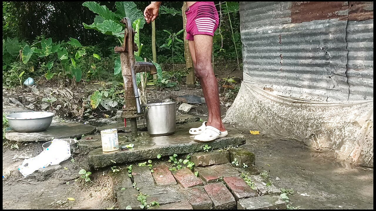 Black mature man bath in desi style. Showing big dick.